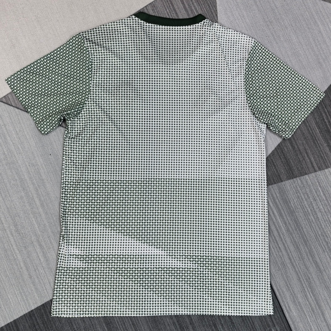 Maillot Mexique spécial 25/26 de la marque Le 12 -ème Maillot, vue de face avec détails du design orange et vert.