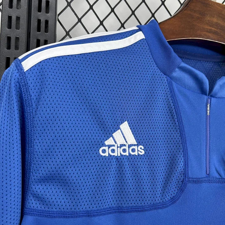 Maillot Chelsea de football rétro 2009-2010, modèle Le 12, affiché en image avec détails du design et couleurs officielles.