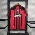 Maillot rétro AC Milan 2007-2008 de la marque Le 12-ème Maillot, vue de face avec logos et détails du design classique.