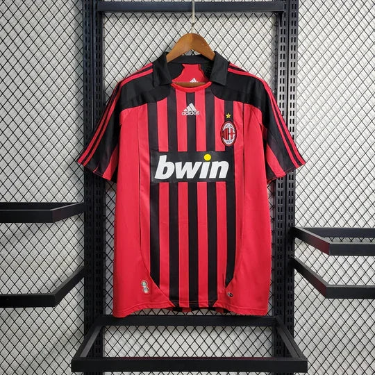 Maillot rétro AC Milan 2007-2008 de la marque Le 12-ème Maillot, vue de face avec logos et détails du design classique.