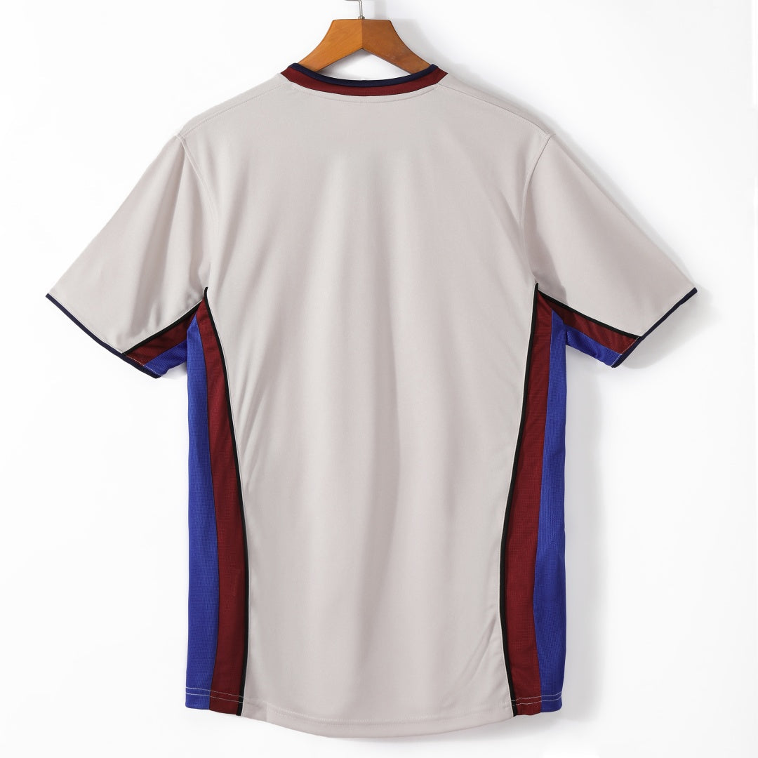 Maillot extérieur rétro du FC Barcelone 1998-1999, modèle Le 12, vue de face avec logo et design classique.