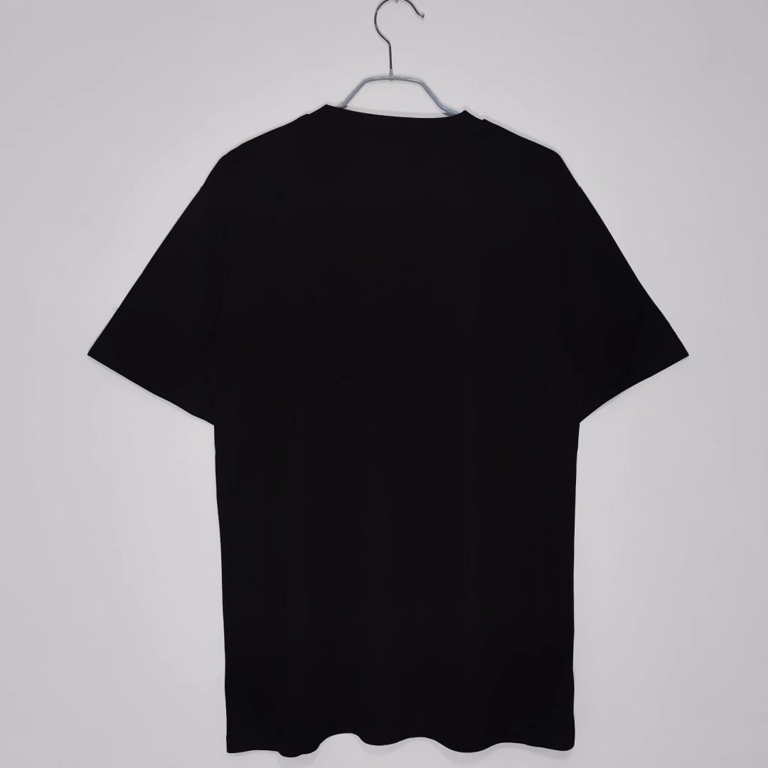 Maillot rétro 2020 du PSG noir de la marque Le 12-ème Maillot, vue de face avec logo et détails du maillot de football.