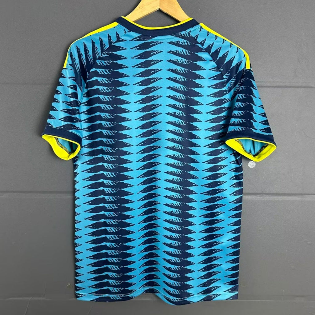 Maillot extérieur pour enfants 25/26 Colombie, marque Le 12 -ème Maillot, avec logo et design coloré.