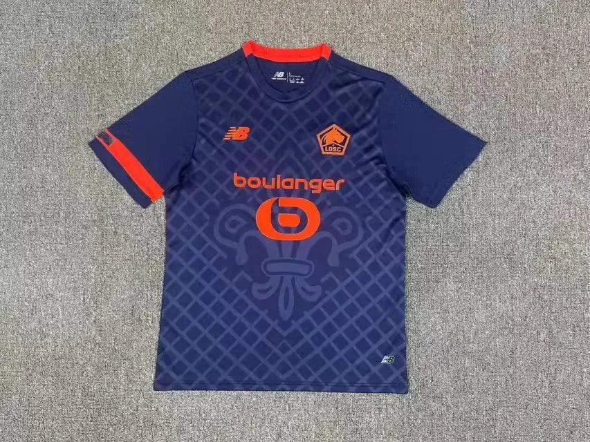 Maillot Lille foot 2023-2024 troisième, marque Le 12 -ème Maillot, jersey orange avec logo et détails sportifs.
