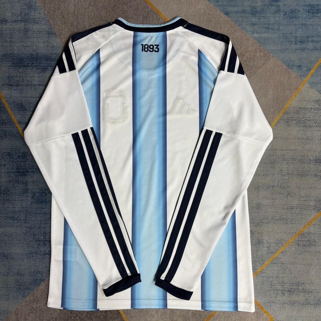 Maillot domicile Argentine 25/26 à manches longues, marque Le 12 -ème Maillot, avec logo et détails bleus et blancs.