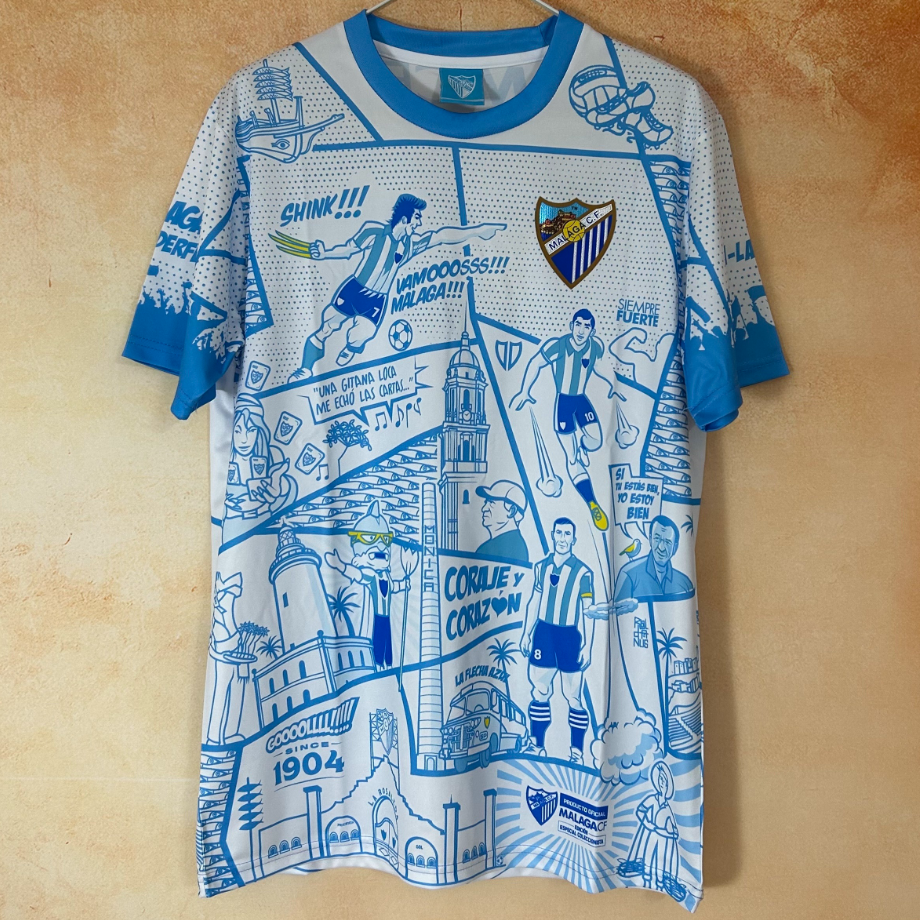 Maillot Malaga 25/26 Le 12 -ème Maillot, maillot de football avec logo et détails en bleu et blanc, vue de face.