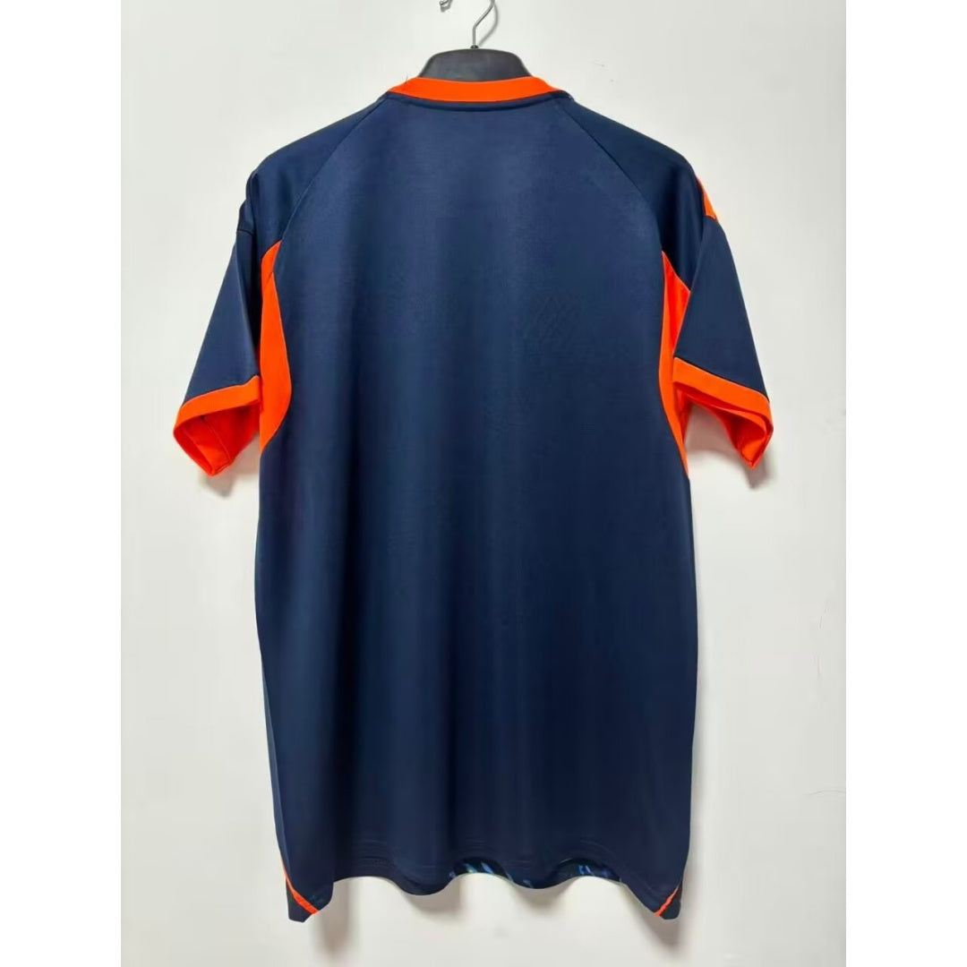 Maillot AJAX 25/26 de la marque Le 12-ème Maillot, motif peinture à l'huile, couleurs vives, vue de face.