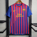 Maillot 11/12 Barcelone Retro de Le 12 -ème Maillot, maillot de football bleu avec logo du club et détails vintage.