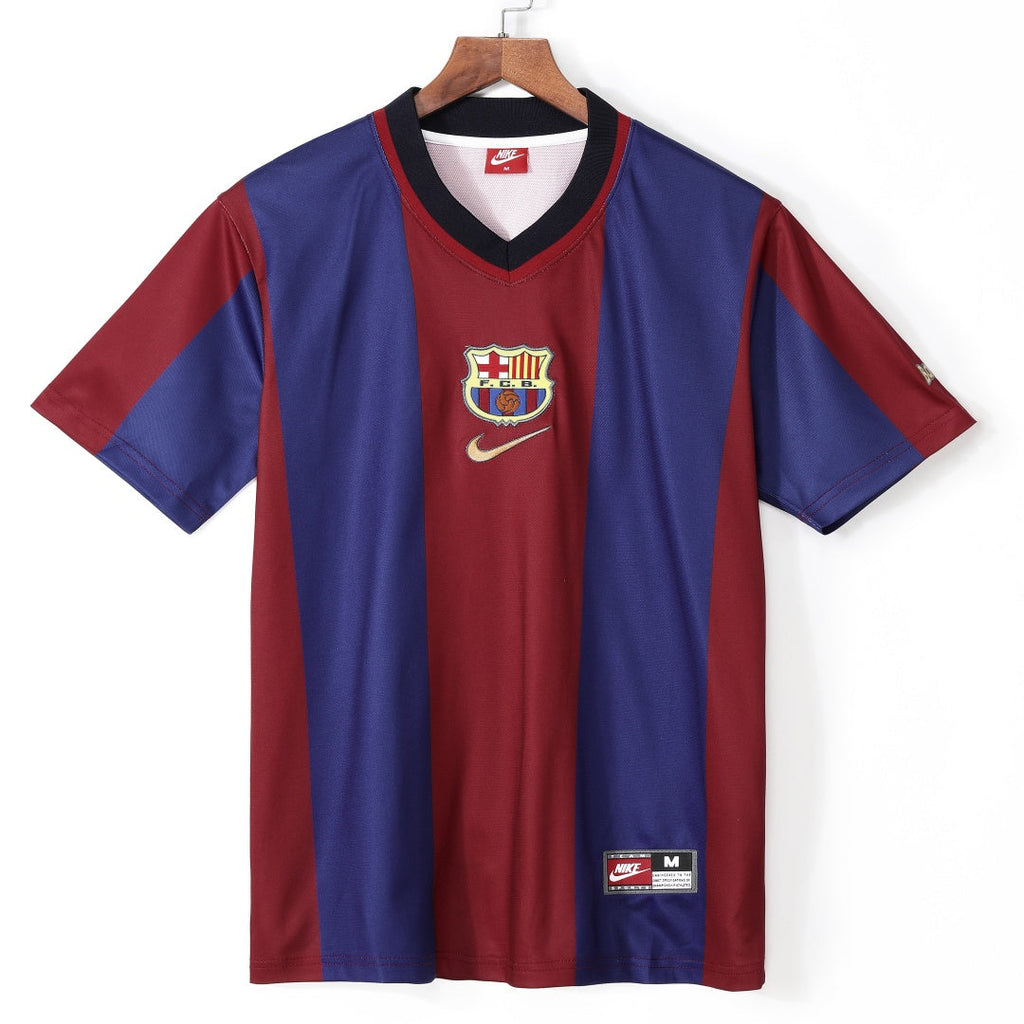 Maillot domicile rétro du FC Barcelone 1998, marque Le 12 -ème Maillot, avec les couleurs traditionnelles blaugrana.