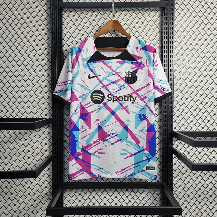 Maillot d'entraînement FC Barcelone saison 2023-2024, édition Le 12, jersey de sport bleu avec logo du club.