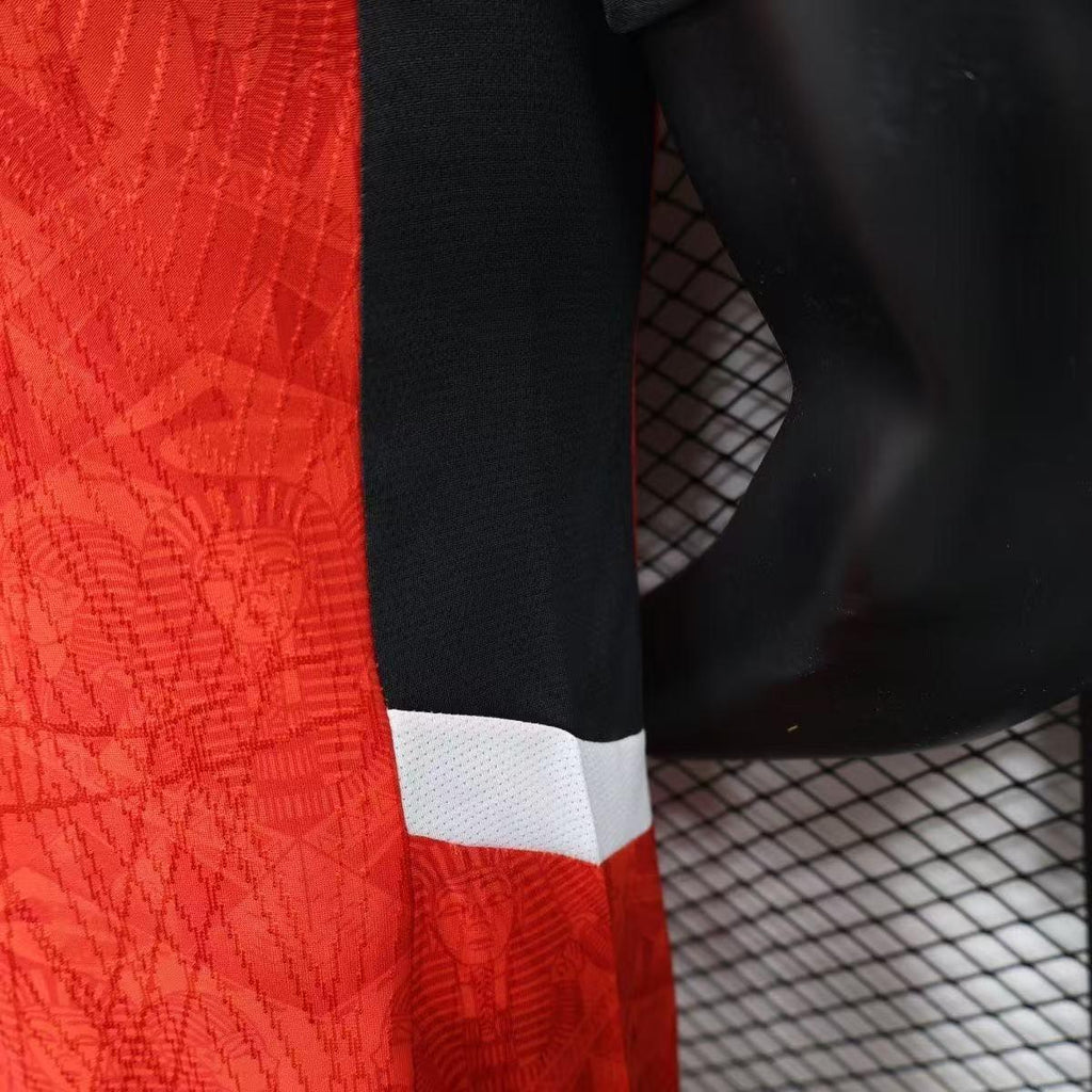 Maillot de football Égypte CAN 2025-26, marque Le 12, vue de face avec logo et motifs rouges et blancs.