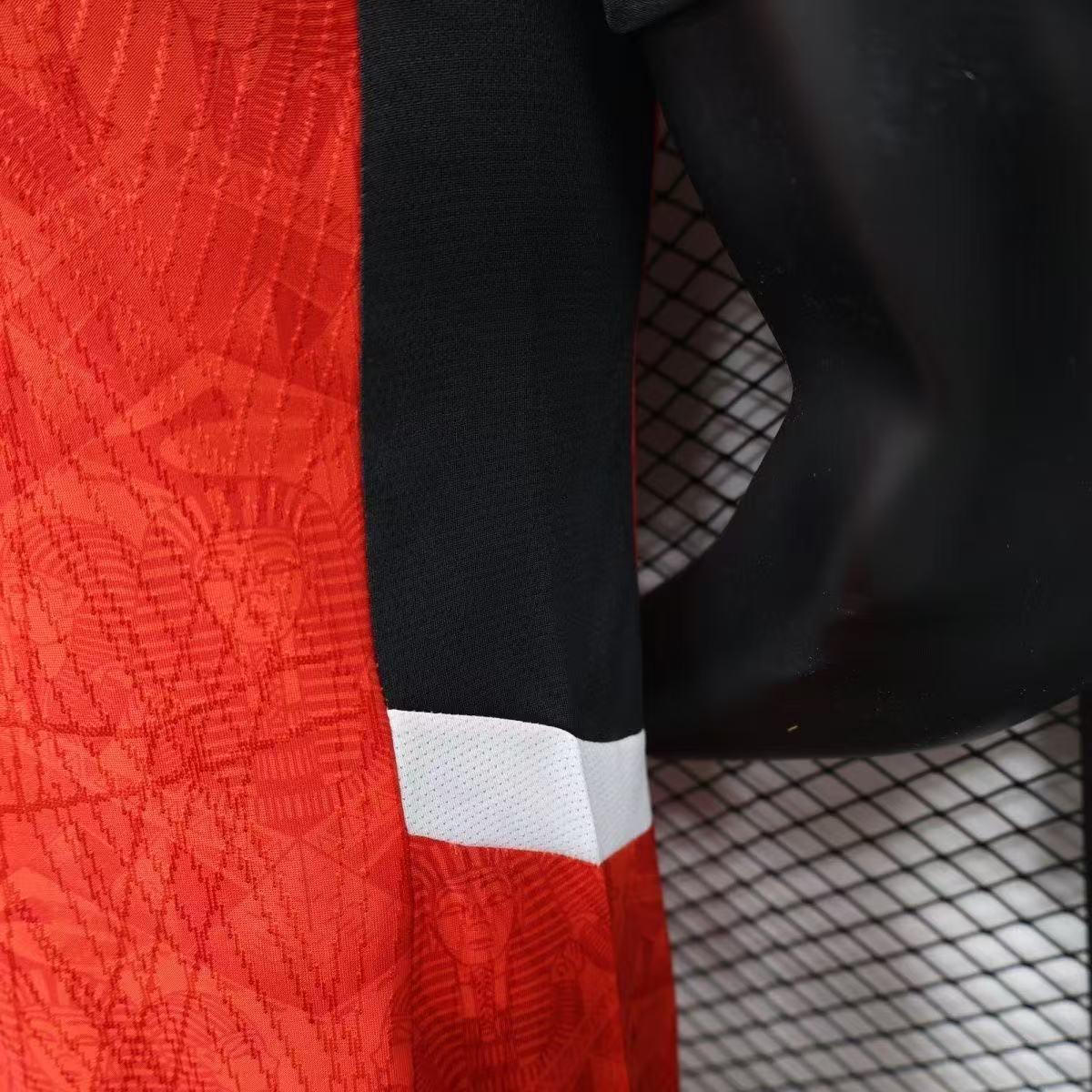 Maillot de football Égypte CAN 2025-26, marque Le 12, vue de face avec logo et motifs rouges et blancs.