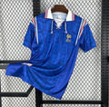 Maillot domicile rétro France 1996, marque Le 12 -ème Maillot, vue de face avec design classique bleu, blanc et rouge.