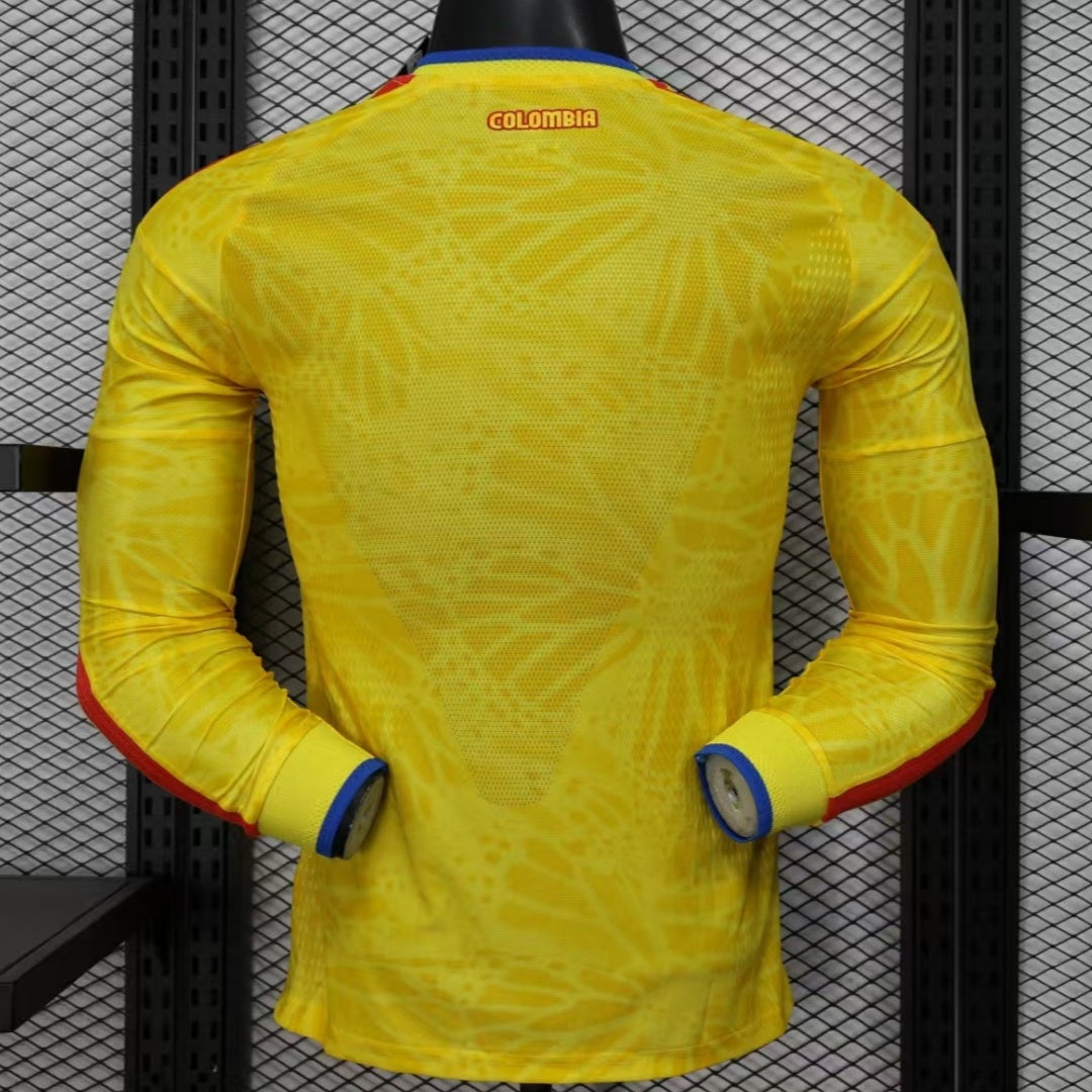 Maillot domicile 25/26 Colombie à manches longues, version joueur, marque Le 12, détails du design blanc et jaune.