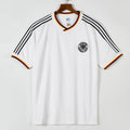 Maillot domicile rétro de l'Allemagne 1986, marque Le 12 -ème Maillot, vue de face avec logo et design traditionnel.