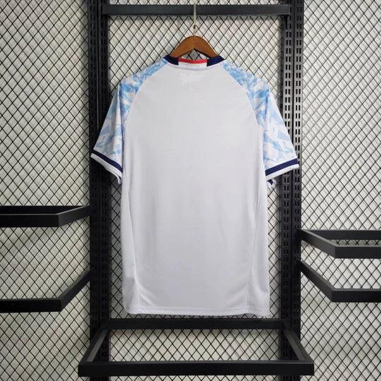 Maillot de football Japon rétro 2016-2017 Le 12ème Maillot, maillot de sport bleu avec logo et détails japonais.