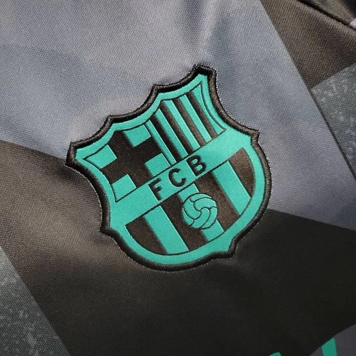 Maillot d'entraînement FC Barcelone 2023 2024 de la marque Le 12, vue de face avec logo et détails du maillot.