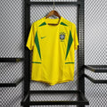 Maillot de football Brésil rétro 2002, marque Le 12 -ème Maillot, vue de face avec logo et design classique, manches courtes.