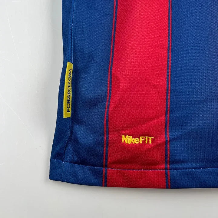 Maillot rétro FC Barcelone 2009/10 Le 12, maillot de football vintage avec logo et couleurs traditionnelles blaugrana.
