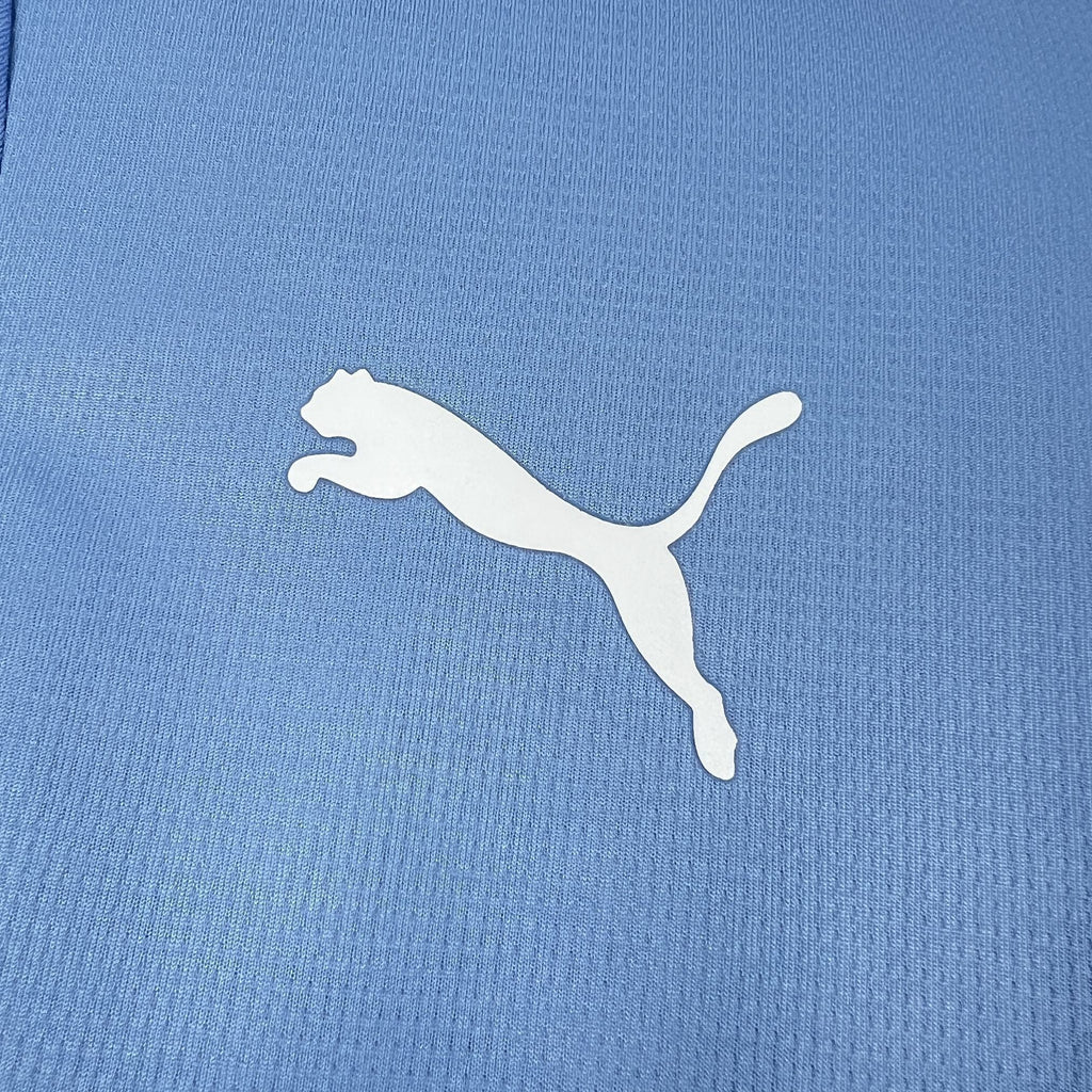 Maillot Manchester City 2026-27 de la marque Le 12 -ème Maillot, vue de face avec logo et détails du maillot officiel.