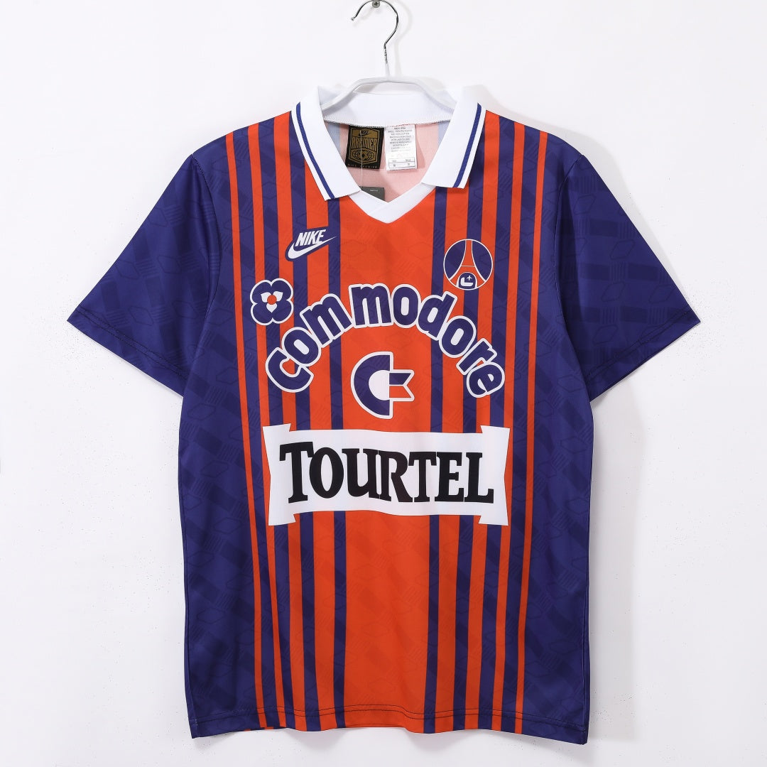 Maillot domicile rétro PSG 1993-1994 de la marque Le 12-ème, maillot de football bleu avec logo du club.
