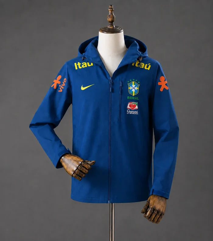 Veste coupe-vent réversible Le 12ème Maillot Brésil Blue, léger et imperméable, avec logo et design coloré visible sur l'image.