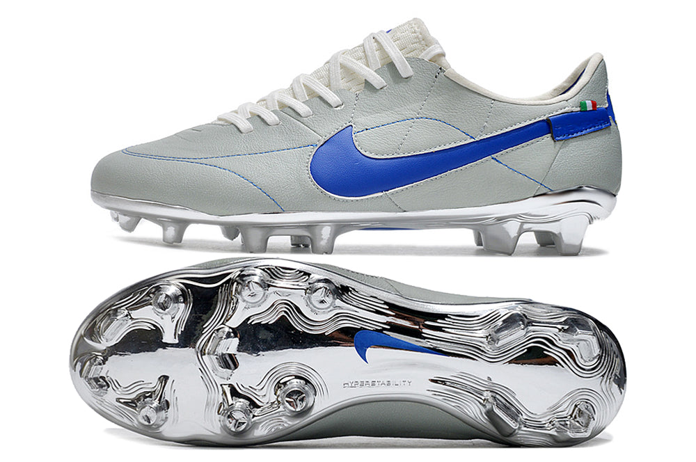 Crampons Le 12 -ème Maillot Tiempo Legend 9 Elite pour escalade, montrant la fixation et la pointe en acier sur sol rocheux