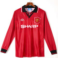 Maillot domicile rétro Manchester United 1994-1996 à manches longues, marque Le 12 -ème Maillot, logo et design vintage visible.