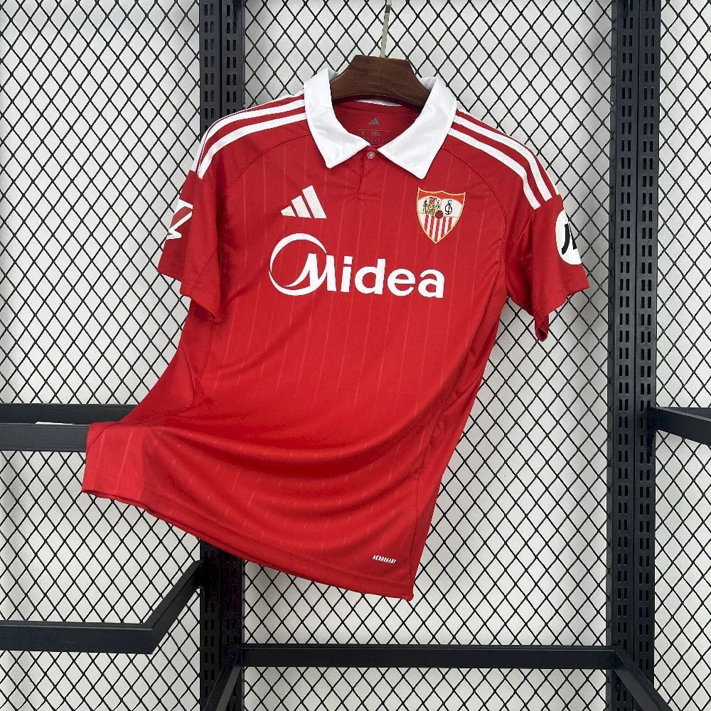 Maillot extérieur du Séville FC 2025-26 de la marque Le 12, vue de face avec détails du design et logo du club.