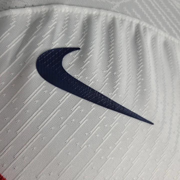 Maillot extérieur Paris 2023-2024 Le 12-ème Maillot, maillot de football avec logo et design moderne visible en détail.