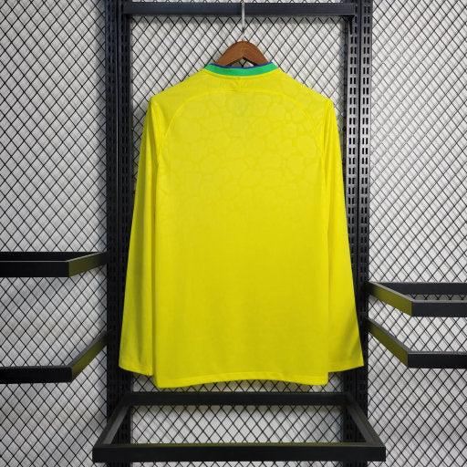 Maillot domicile Brésil 2022/23 Coupe du Monde, manches longues, marque Le 12, jersey de football avec logo et design brésilien.