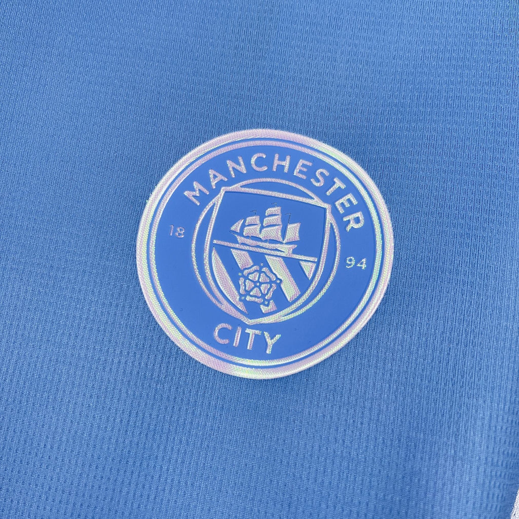 Maillot Manchester City 2026-27 de la marque Le 12 -ème Maillot, vue de face avec logo et design officiel du club.