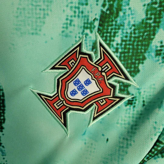 Maillot Portugal entraîne­ment 2023-2024 Le 12, maillot de sport léger avec logo Portugal et design sportif visible sur l'image.
