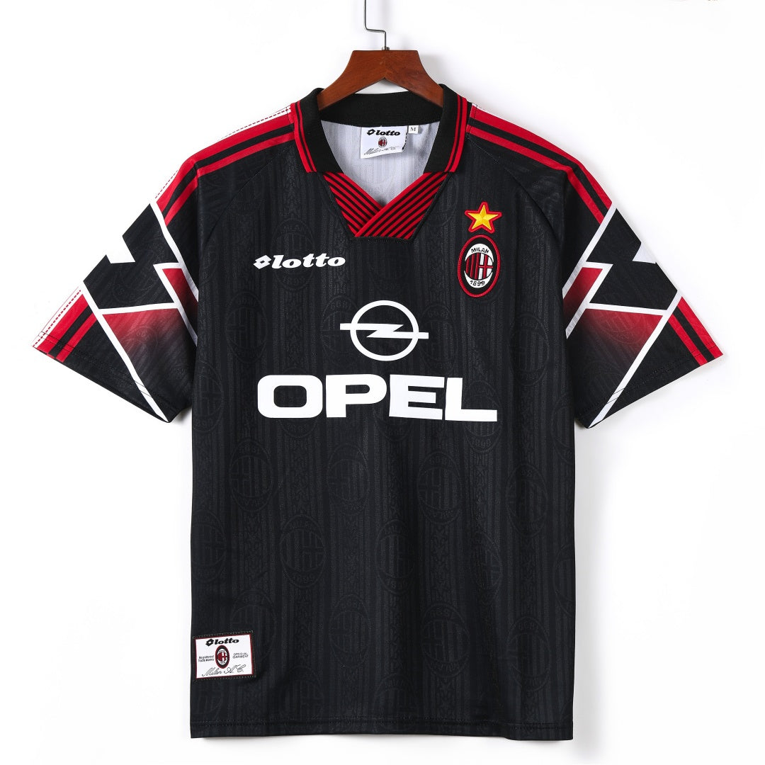 Maillot rétro troisième de l'AC Milan 1997-1998, marque Le 12-ème Maillot, en tissu avec logo et détails du club.