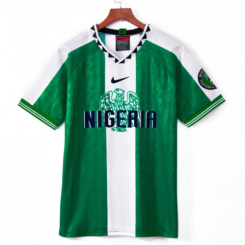 Maillot domicile rétro du Nigeria 1996, marque Le 12-ème Maillot, maillot de football jaune avec détails verts.