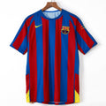 Maillot domicile rétro du FC Barcelone 2005-2006, marque Le 12, vue de face avec logo et détails du maillot.