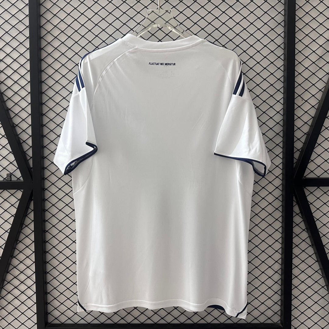 Maillot extérieur Paris FC 25/26 de Le 12-ème Maillot, maillot de football bleu avec logo du club visible.