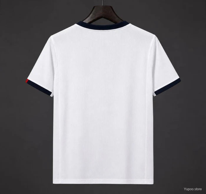 Maillot extérieur PSG 26/27 Champions Le 12ème Maillot, maillot de football bleu avec logo PSG et détails champions.