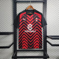 Maillot d'entraînement AC Milan 2023-2024, marque Le 12 -ème Maillot, jersey sportif avec logo et détails du club.