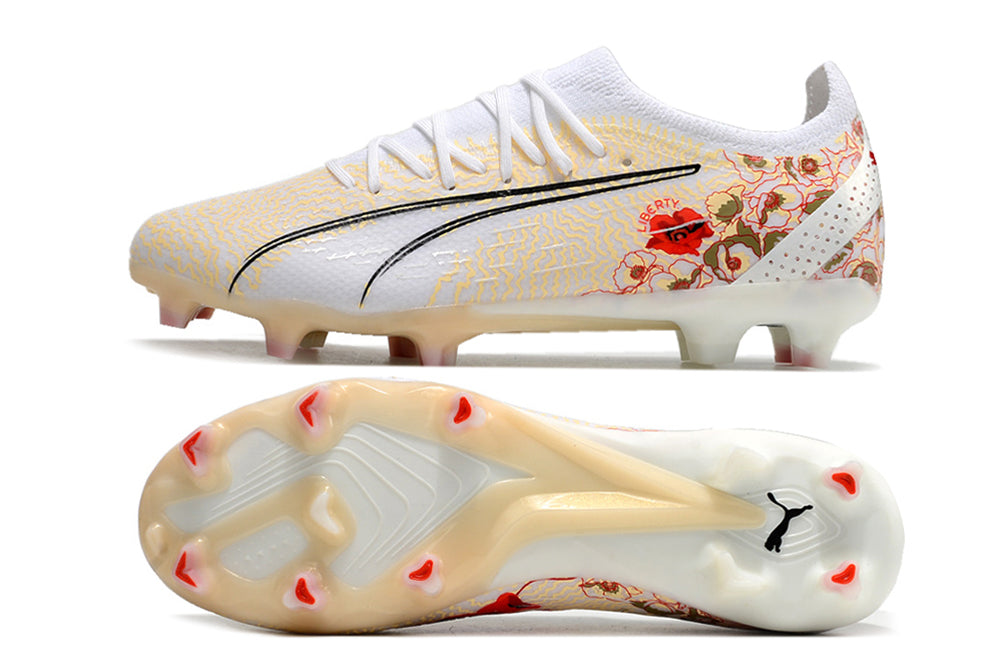 Crampons Ultra Ultimate FG Le 12 -ème Maillot, fixation métallique pour chaussures de sport, vue en gros plan.