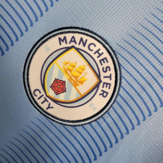 Maillot Manchester City 2023 2024 manches longues de Le 12 -ème Maillot, maillot de football bleu avec logo et détails.