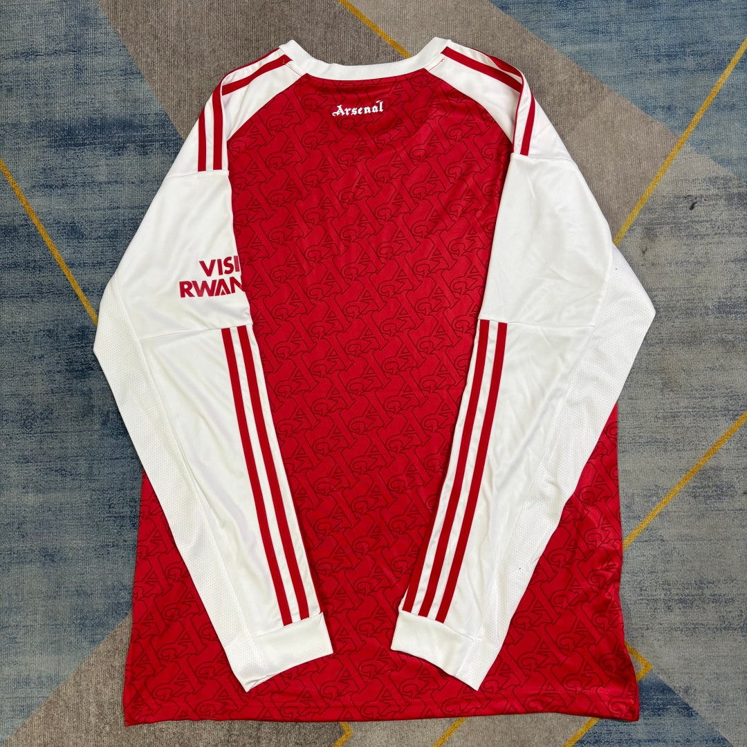 Maillot domicile Arsenal 25/26 à manches longues, marque Le 12 -ème Maillot, en tissu bleu avec logo et détails du club.