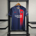 Maillot domicile Paris Saint Germain saison 2023-2024, marque Le 12 -ème Maillot, vue de face avec logo et détails du maillot.