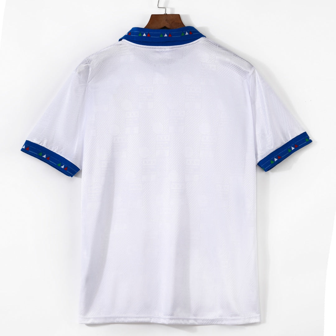 Maillot extérieur rétro de l'équipe d'Italie 1994, marque Le 12, en bleu avec logo national visible.