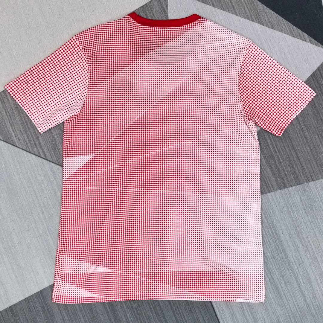 Maillot 25/26 Canada Le 12 -ème Maillot, maillot de sport bleu avec logo du Canada et détails en rouge et blanc.