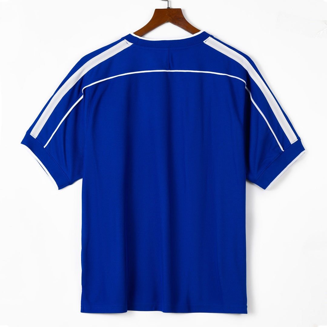 Maillot extérieur Brésil 1998 rétro, marque Le 12 -ème Maillot, vue de face avec logo et design vintage.