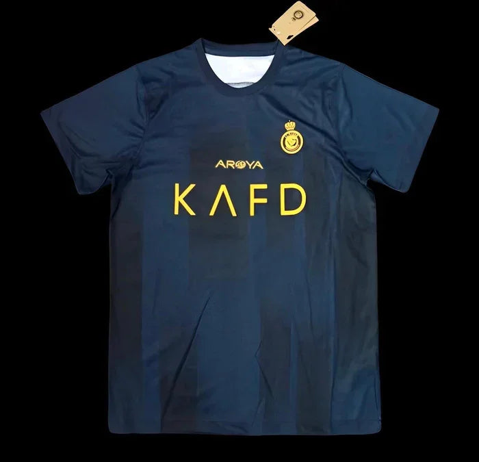 Maillot extérieur Al-Nassr saison 2023-2024, marque Le 12, avec logo et design sportif visible sur le maillot.