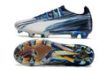 Crampons Ultra Ultimate FG de Le 12 -ème Maillot, conçus pour l'escalade ou le sport de terrain, avec pointes en acier robustes.