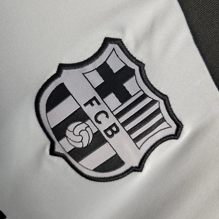Maillot d'entraînement FC Barcelone 2023-2024 Le 12, maillot de sport bleu avec logo du club et détails de l'équipe.