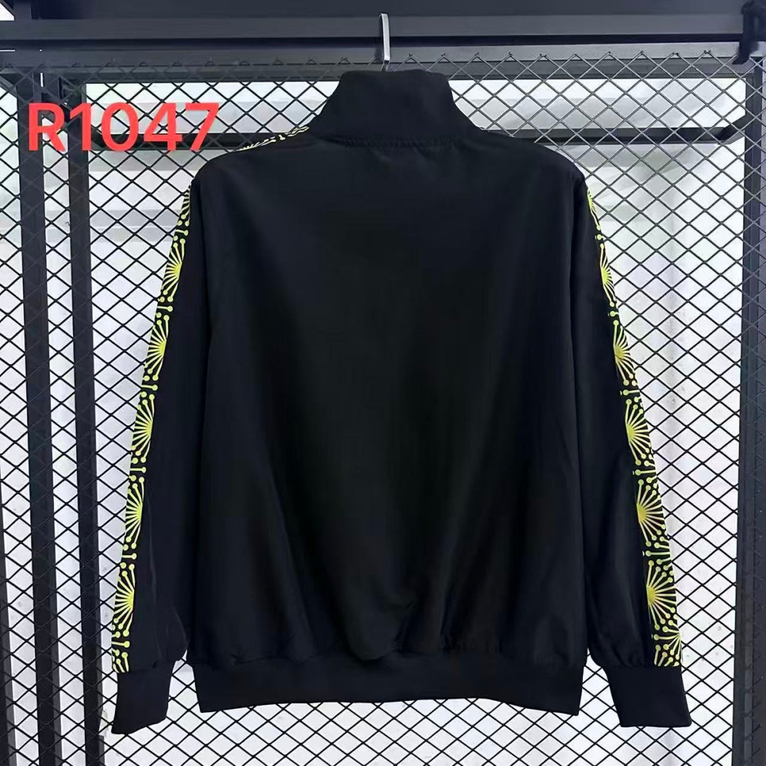 Veste coupe-vent réversible Le 12 -ème Maillot Mexique, légère et résistante, avec design coloré visible sur l’image.